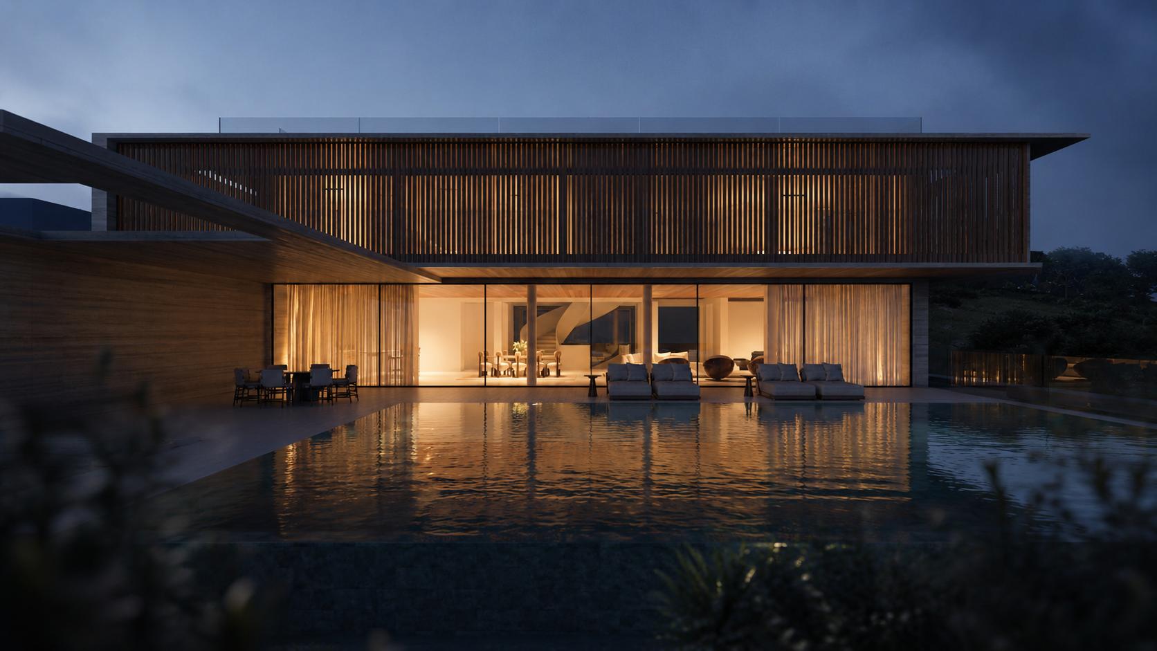 A GAVINHO residence at dusk, viewed from the pool